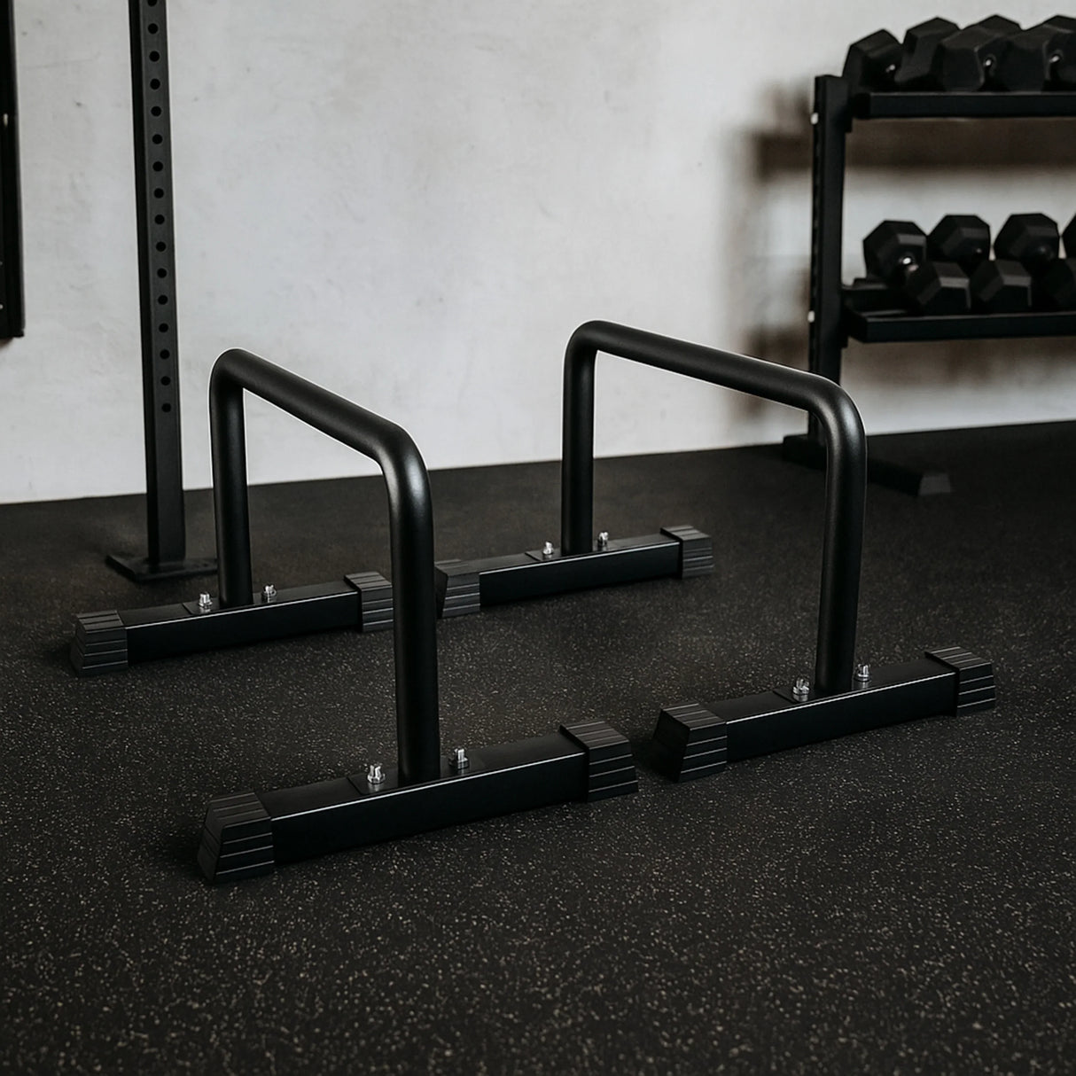 Large parallettes in matte black finish, featuring sturdy metal construction and non-slip rubber feet, ideal for bodyweight exercises