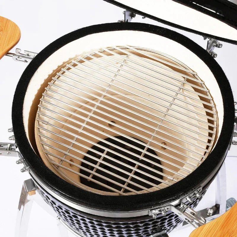 21-inch Fresh Grills Kamado charcoal BBQ grill with a ceramic interior, stainless steel cooking grate, and wooden side shelves