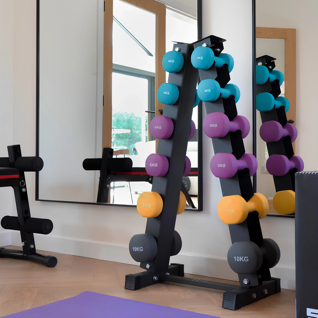 Colorful neoprene dumbbells in a sleek black rack, featuring weights of 6kg, 8kg, and 10kg, set against a modern gym backdrop