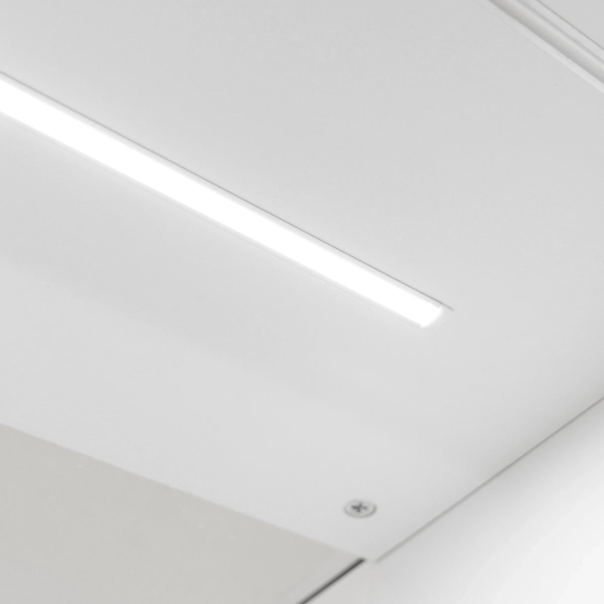 Sleek white LED lighting fixture with a minimalist design, ideal for illuminating shop counters and enhancing modern interiors