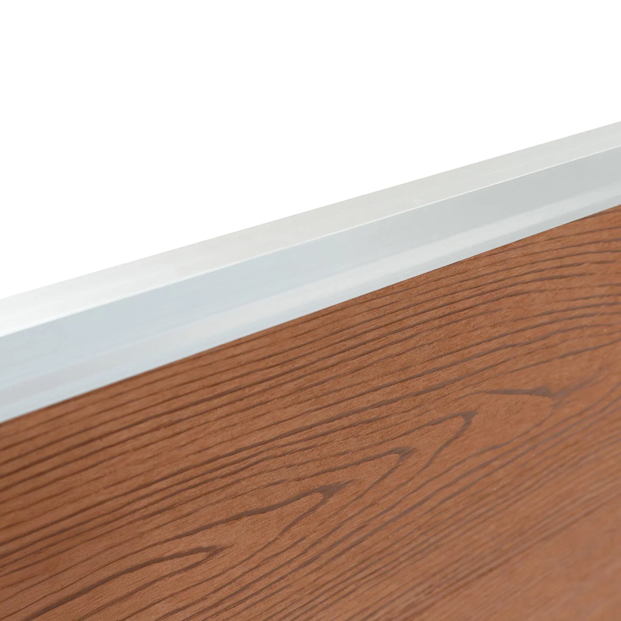 Composite fence panel with a rich brown wood grain texture and sleek aluminum top rail, showcasing durability and modern design
