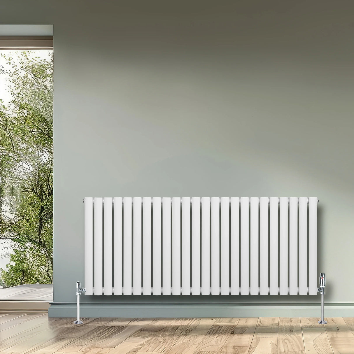 White oval single column radiator with sleek vertical lines, mounted on a wall, complementing a modern interior with natural light