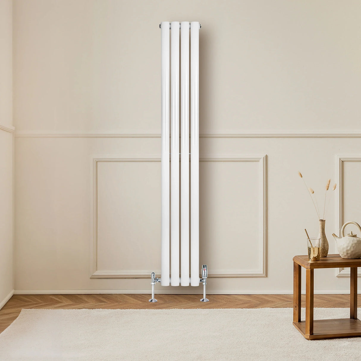 Sleek white oval single column radiator with valves, 1600mm x 240mm, mounted on a light wall in a modern living space