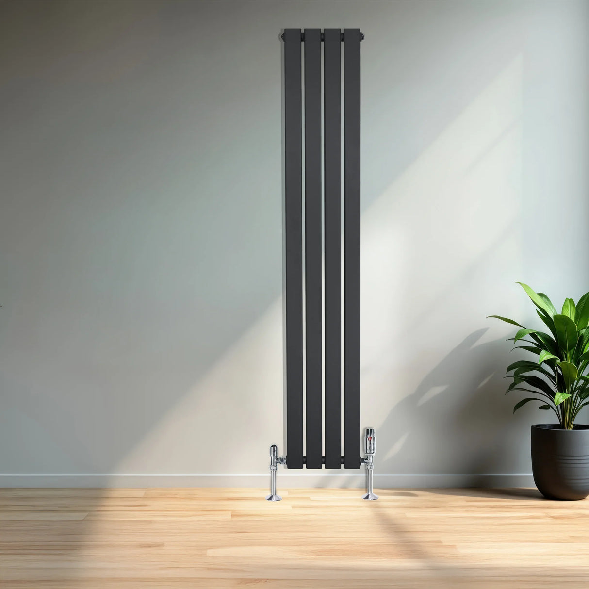 Flat single column radiator in anthracite grey, 1600mm x 280mm, featuring sleek vertical lines and chrome valves, set against a modern interior