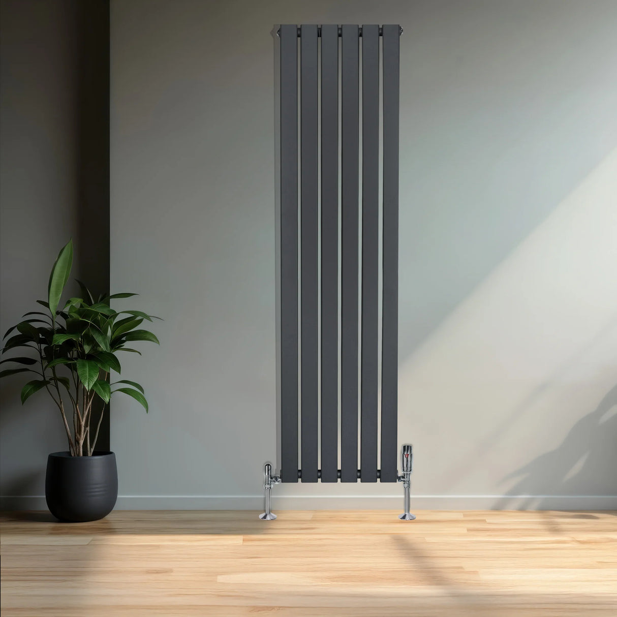 Flat single column radiator in anthracite grey, 1600mm x 420mm, featuring sleek vertical lines and chrome valves, set against a modern interior