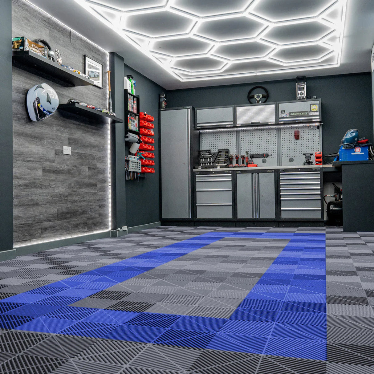 Vented garage floor tiles in grey and blue, featuring a textured surface, arranged in a stylish pattern, enhancing the modern garage space
