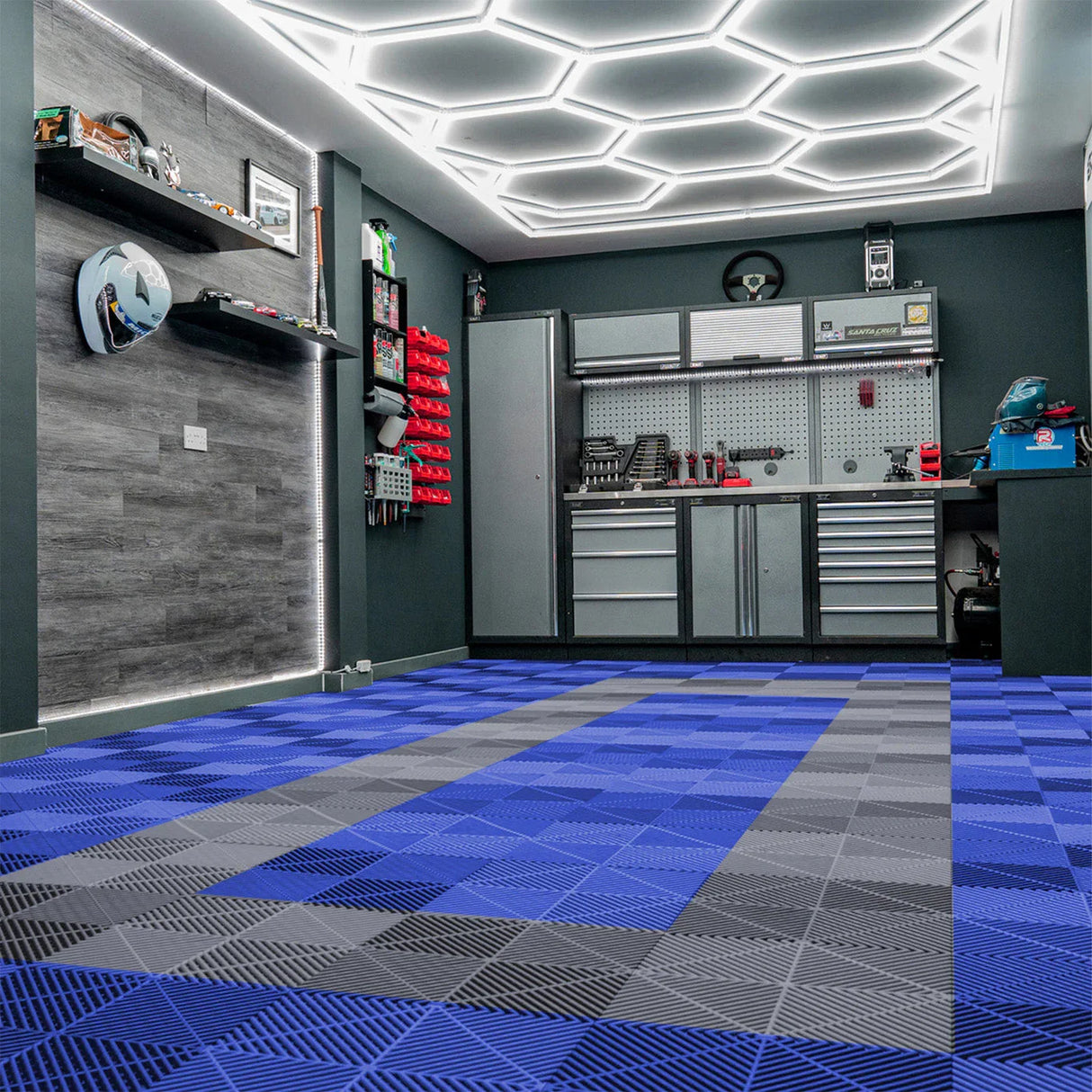 Vented garage floor tiles in blue and grey, featuring a textured surface and interlocking edges, arranged in a stylish pattern
