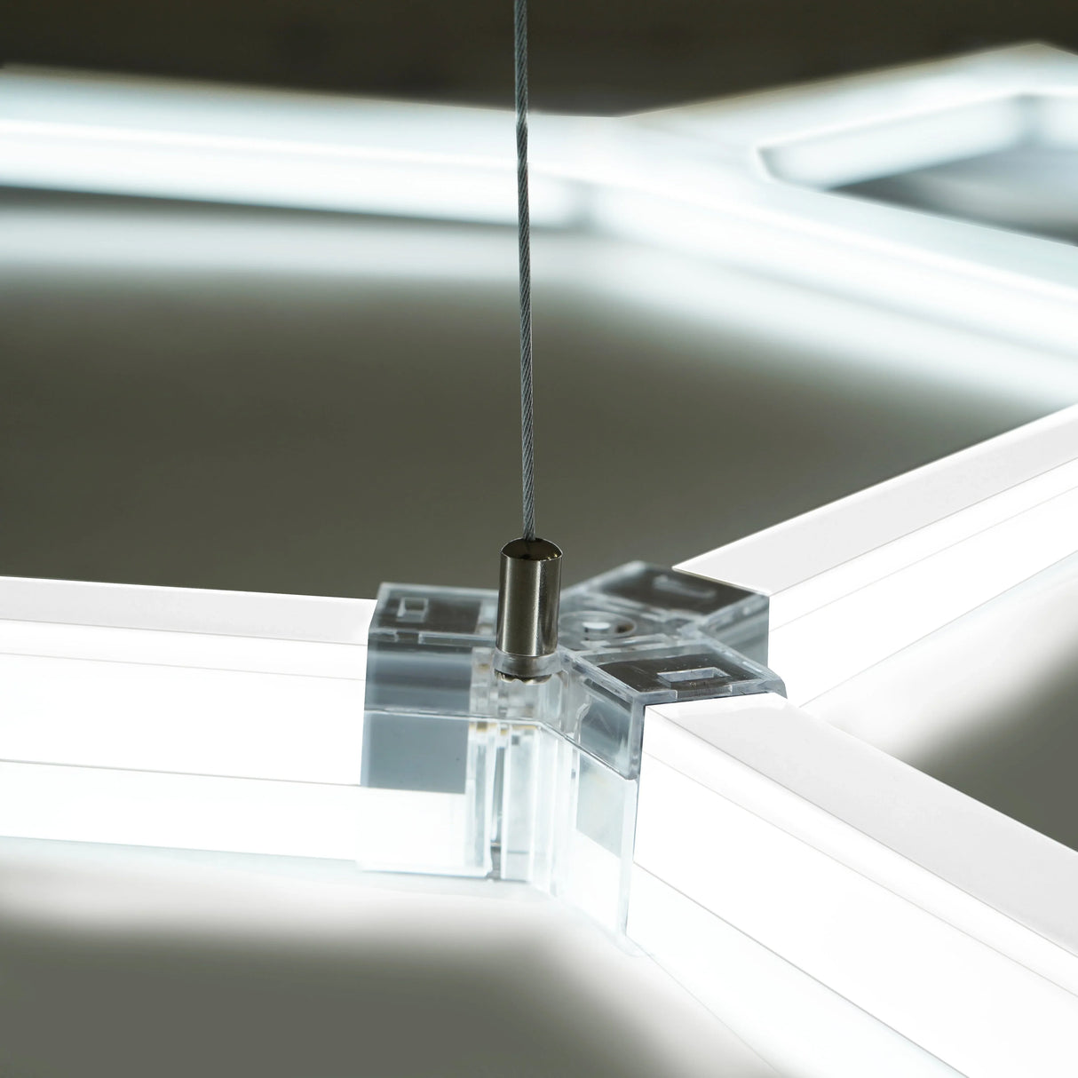 Hexagon LED light fixture with clear edges, showcasing a sleek design and modern aesthetic, ideal for stylish lighting solutions