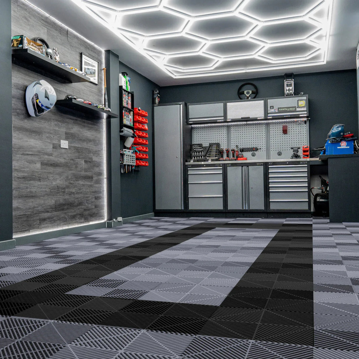 Hexagon LED lights illuminate a modern garage with grey and black vented floor tiles, showcasing a sleek, textured design