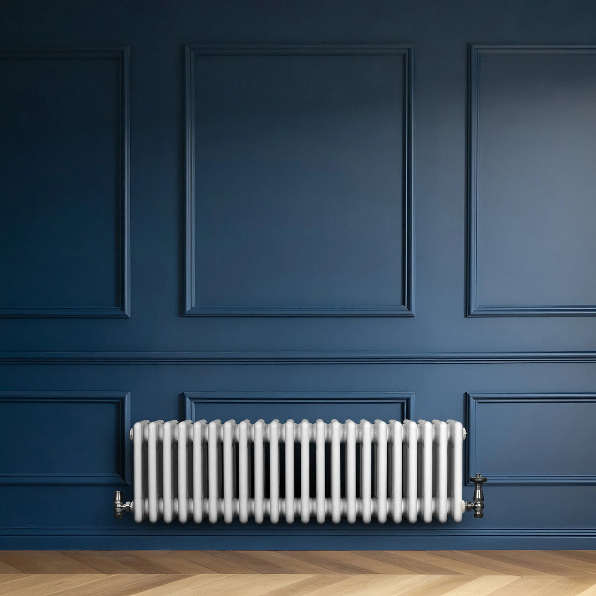 Traditional 4 column radiator in white, 300 x 1010mm, mounted on a blue wall, showcasing a sleek, vintage design with smooth, rounded edges
