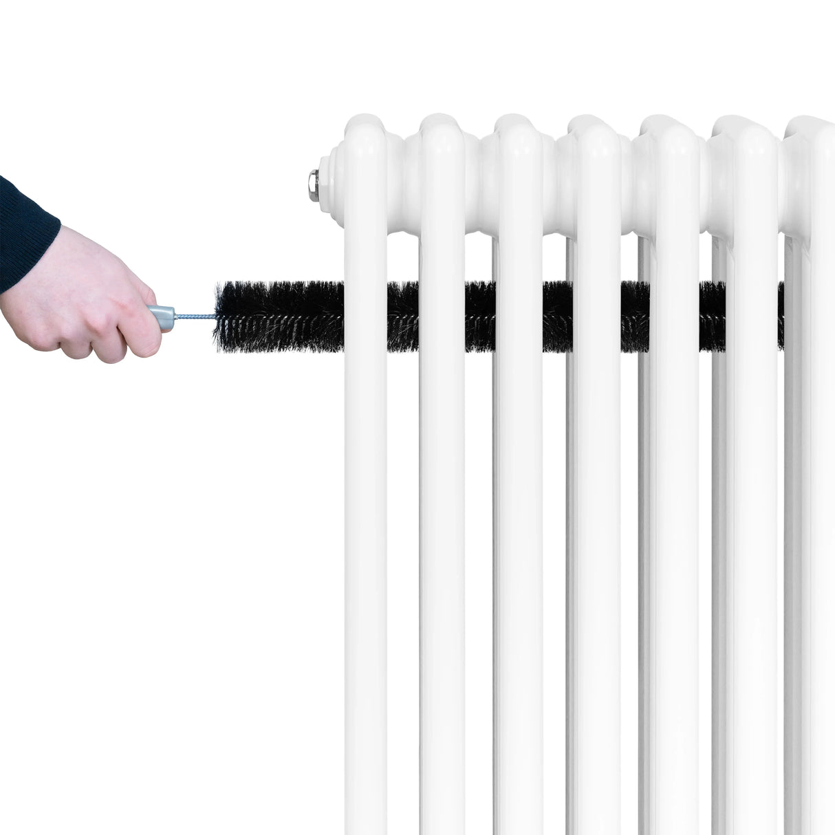 Traditional white 4 column radiator being cleaned with a brush, showcasing its smooth, glossy finish and classic design