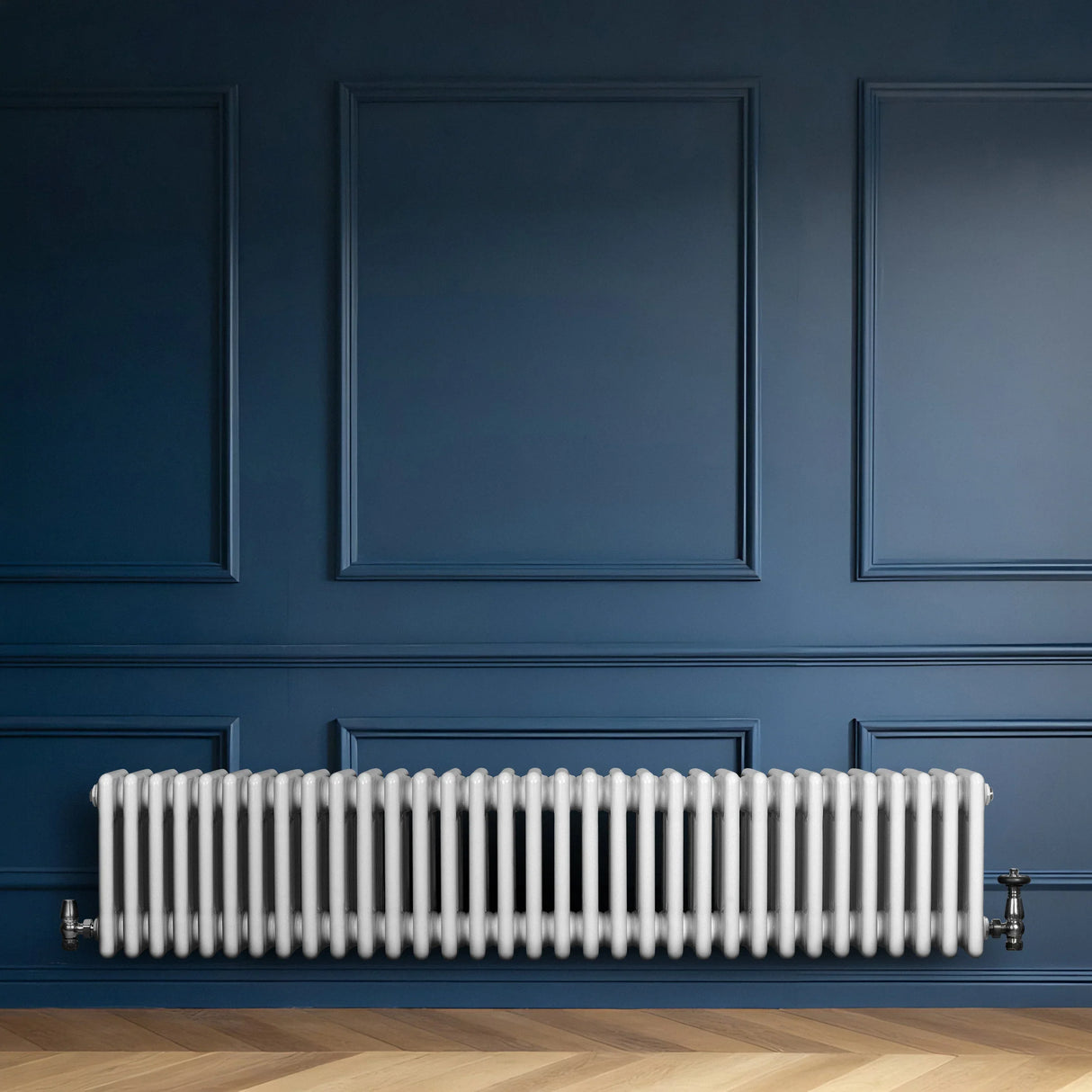 Traditional white 4 column radiator, 300 x 1505mm, installed against a deep blue wall, showcasing a sleek, modern design and smooth finish