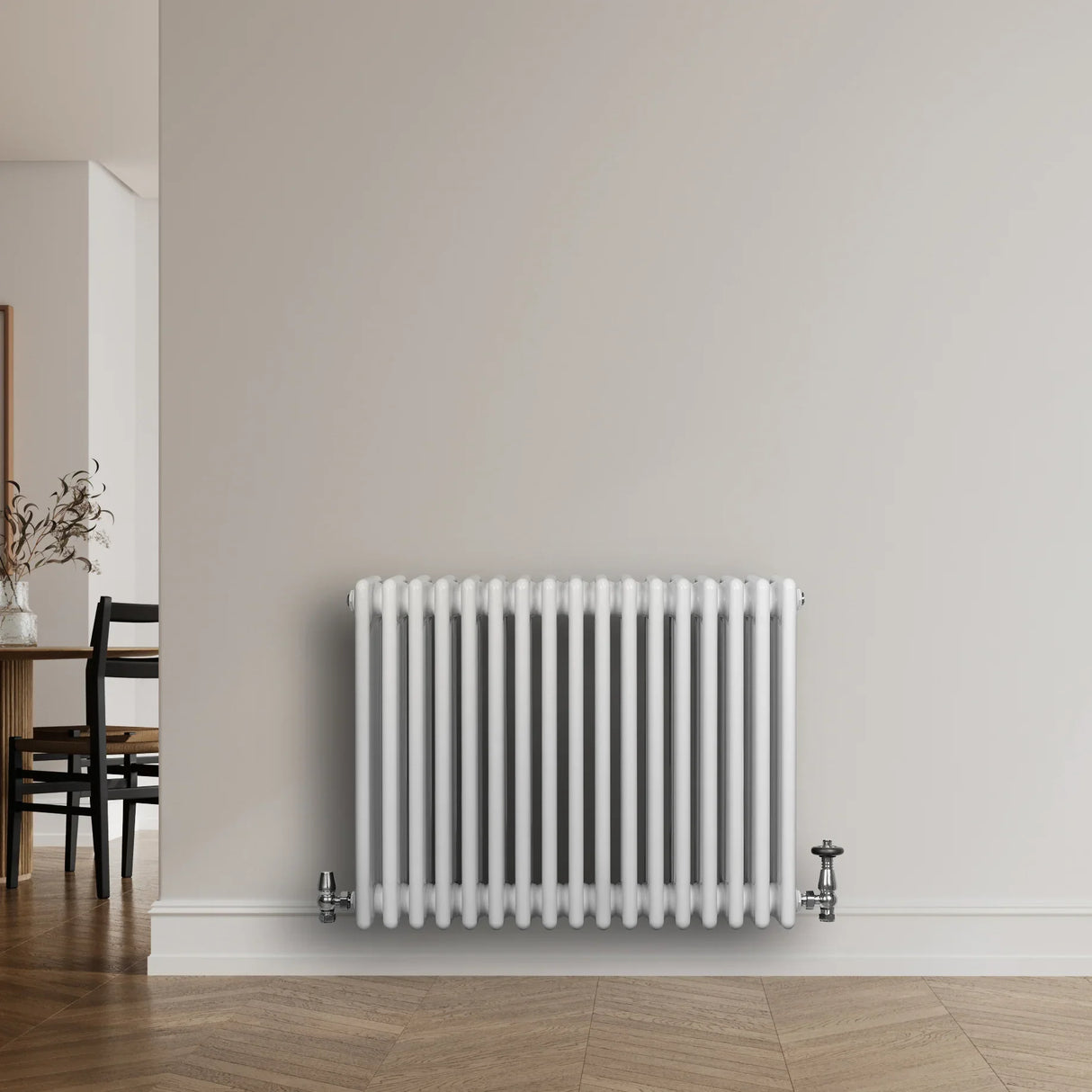 Traditional 4 column radiator in white, 600 x 785mm, featuring a sleek, smooth finish and mounted against a neutral wall in a modern room