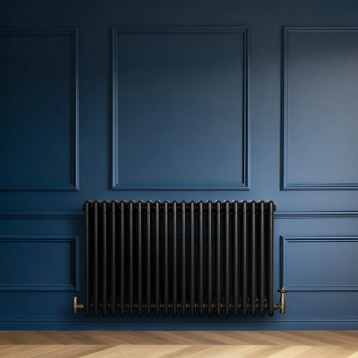 Traditional black 4 column radiator with a sleek finish, mounted against a deep blue wall, showcasing elegant design and functionality