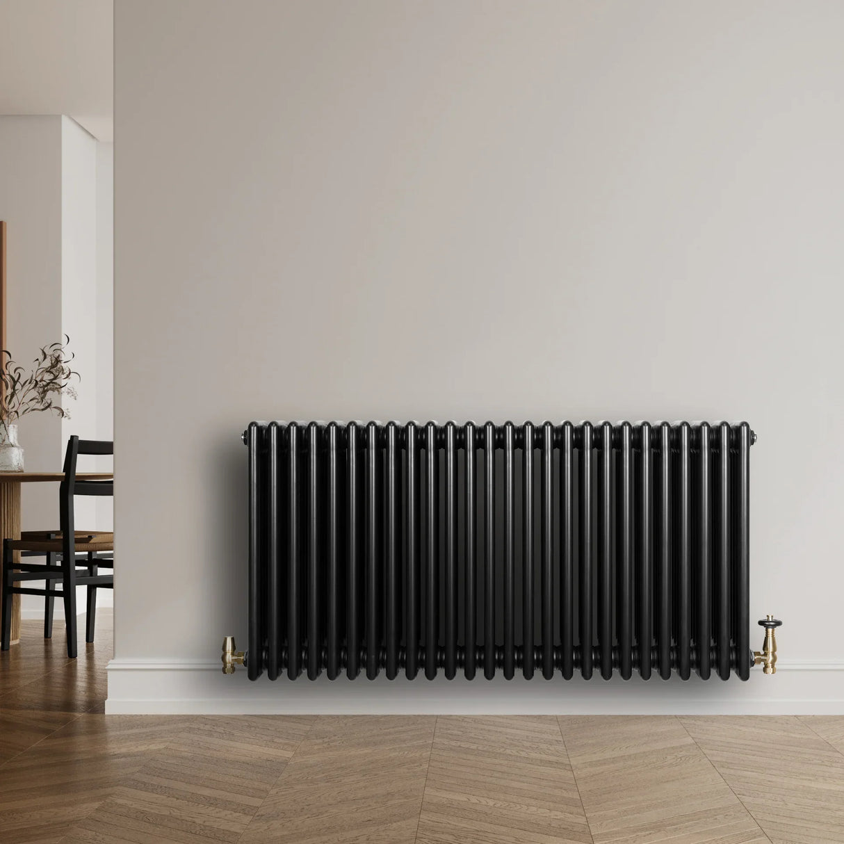 Traditional black 4 column radiator, 600 x 1190mm, featuring a sleek design and smooth finish, mounted on a light wall in a modern room