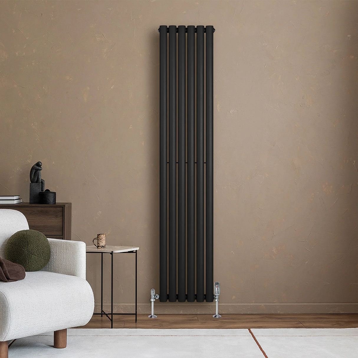Sleek black oval single column radiator stands against a textured beige wall, complementing modern decor with a minimalist design