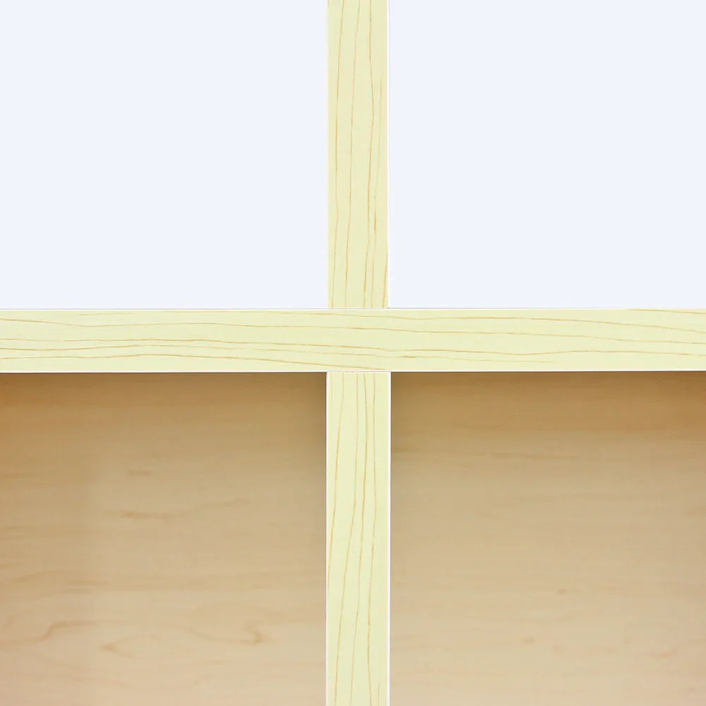 Light maple wood shop counter featuring a smooth, natural grain finish and spacious, open shelving for storage and display