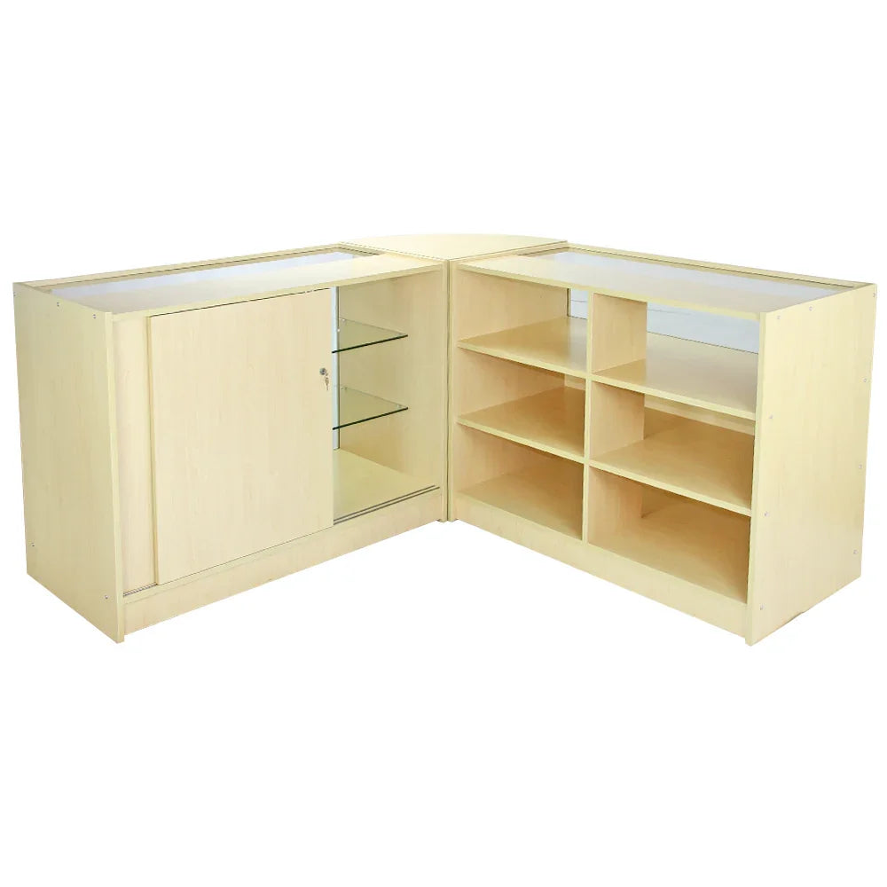 Aquarius Maple Shop corner display counters in light maple finish, featuring glass shelves and storage compartments for retail use
