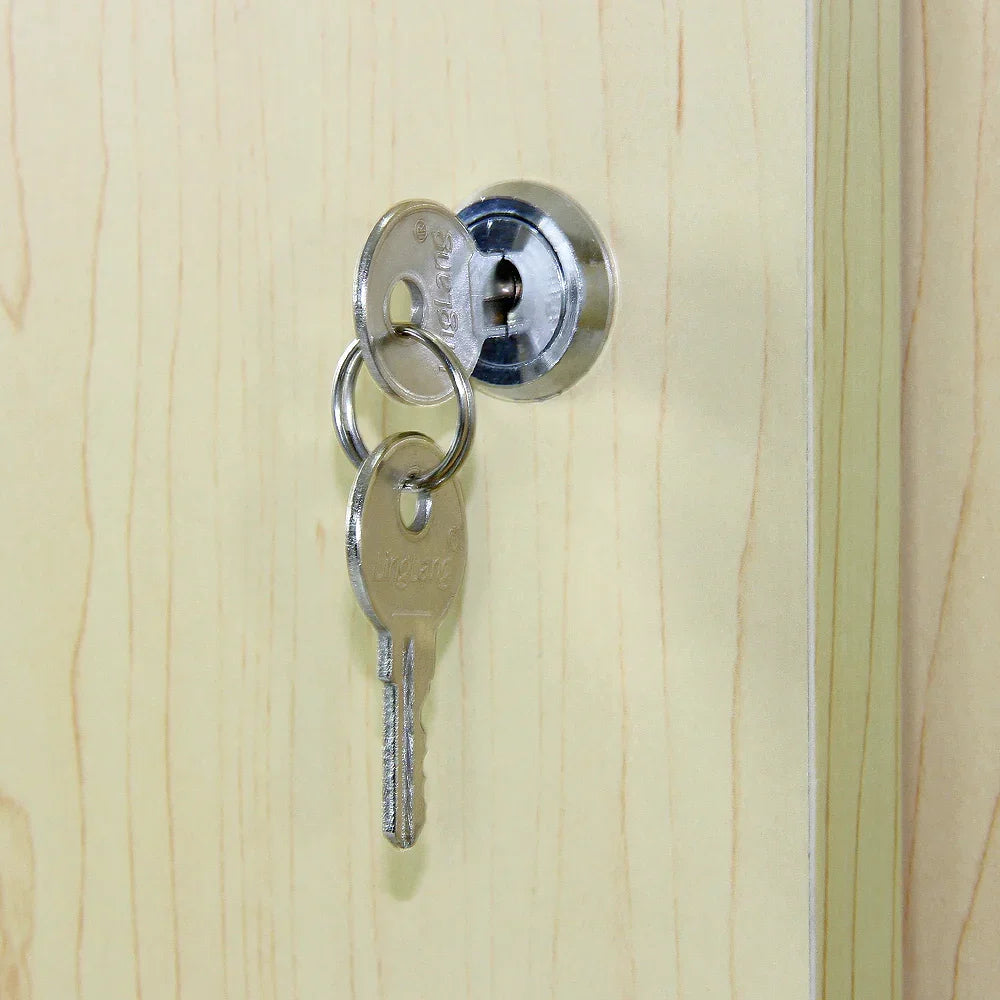 Close-up of a silver key inserted into a round lock on a maple-glazed display counter, showcasing the smooth wood grain finish