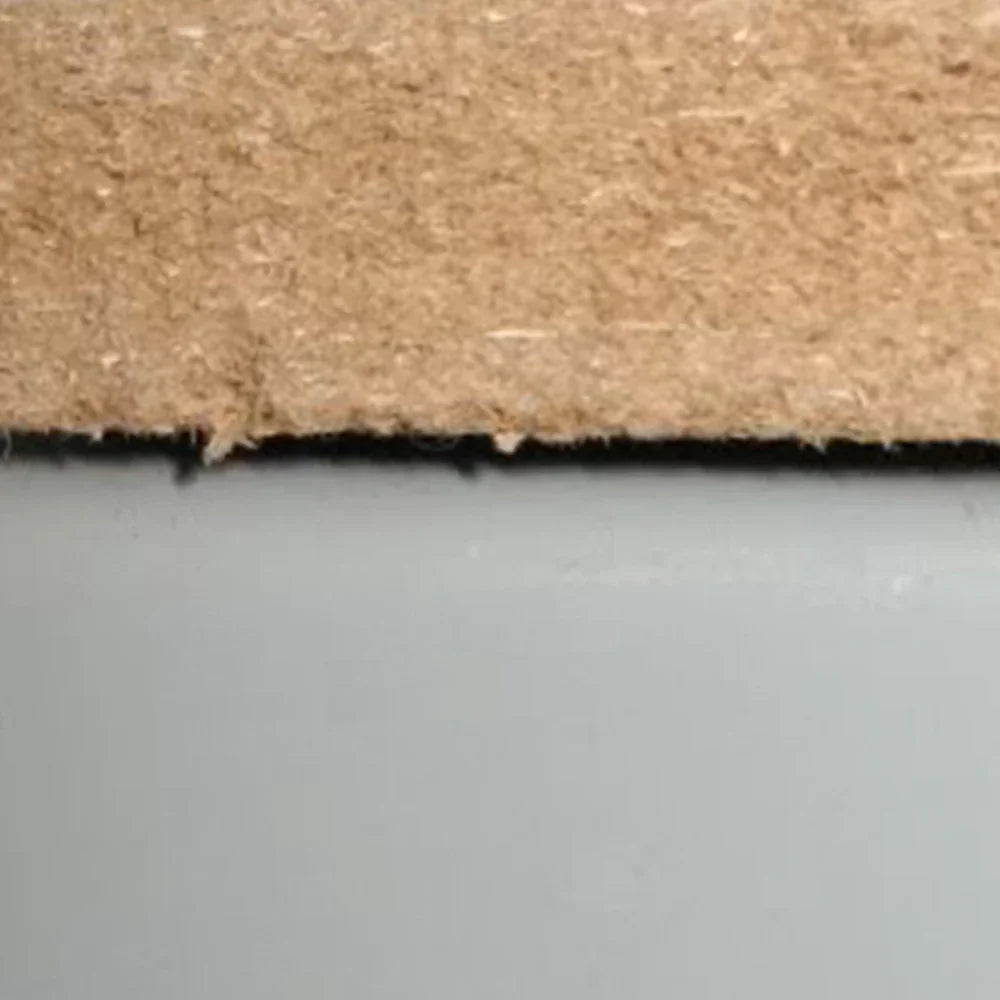 Close-up of the grey Q Rax shelf, highlighting the smooth surface and sturdy edges, showcasing its durable material and finish
