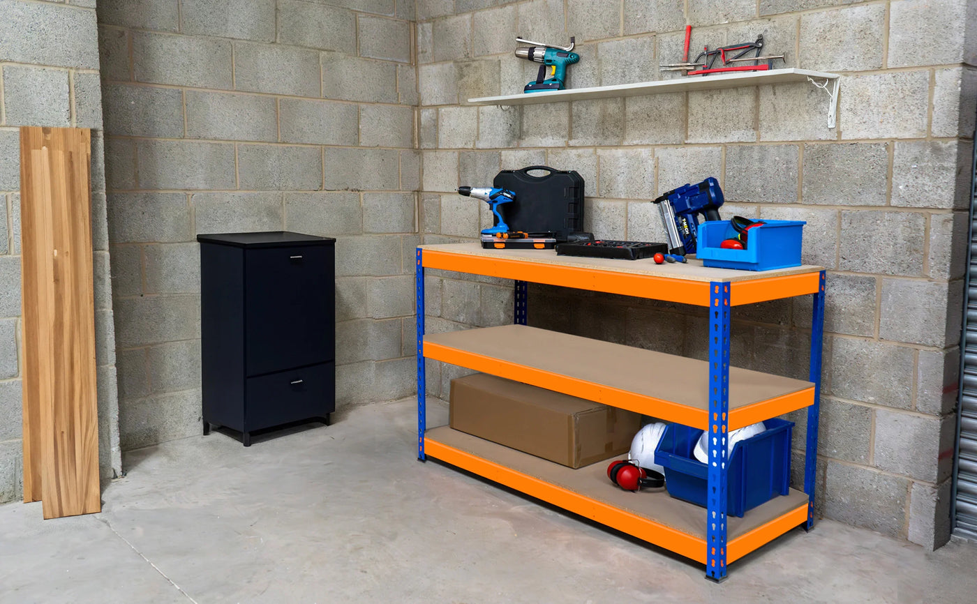 Bright blue and orange shelving unit in a garage with tools, storage boxes, and a black cabinet against a concrete wall