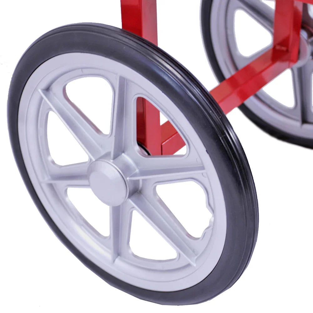 Close-up of the sturdy black rubber wheel on the red cart of the KuKoo Commercial 8oz Popcorn Maker, showcasing its durable design