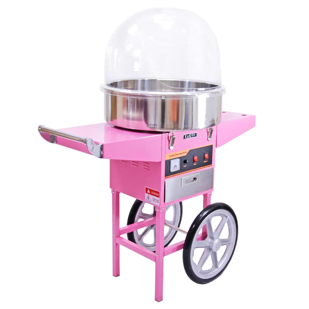 KuKoo pink candy floss machine with stainless steel bowl, protective dome, and cart, featuring wheels and control panel for easy use