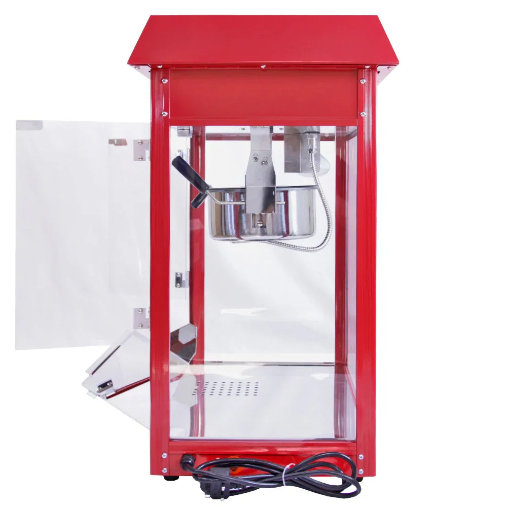 Red KuKoo 8oz commercial popcorn machine with a stainless steel kettle, clear glass sides, and a vintage-style design for easy viewing