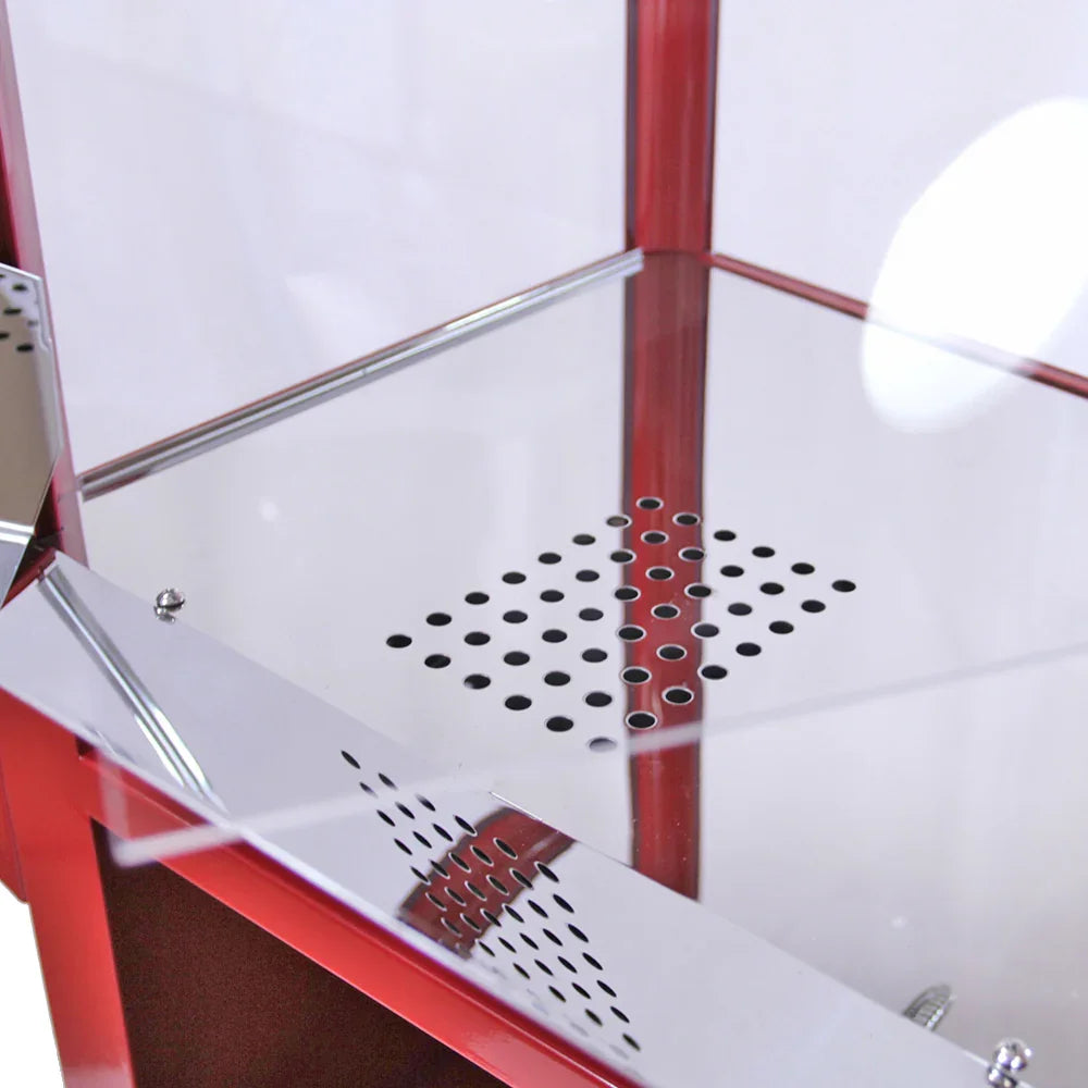 Shiny stainless steel interior of the KuKoo 8oz popcorn and candy floss machine with a perforated base for even heat distribution