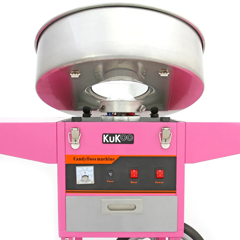 Bright pink candy floss machine with stainless steel bowl, featuring control panel with power, heat, and temperature settings