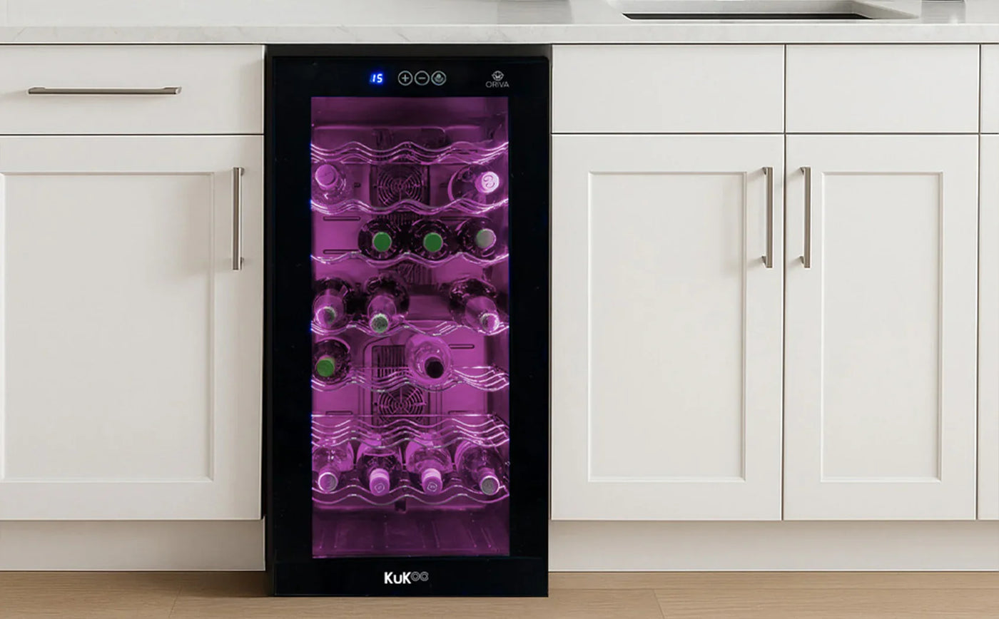 Sleek black wine cooler with a glass door, showcasing illuminated bottles on metal racks against a modern kitchen backdrop