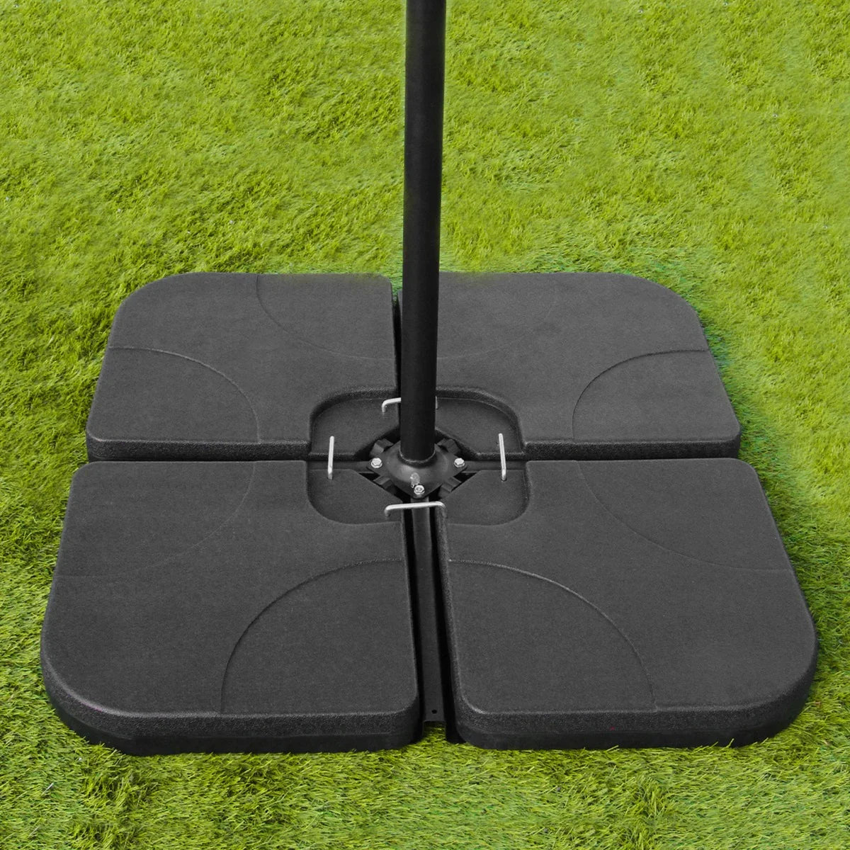 Grey 3m LED cantilever parasol base with a sturdy, square design, featuring textured black material on a green grass background