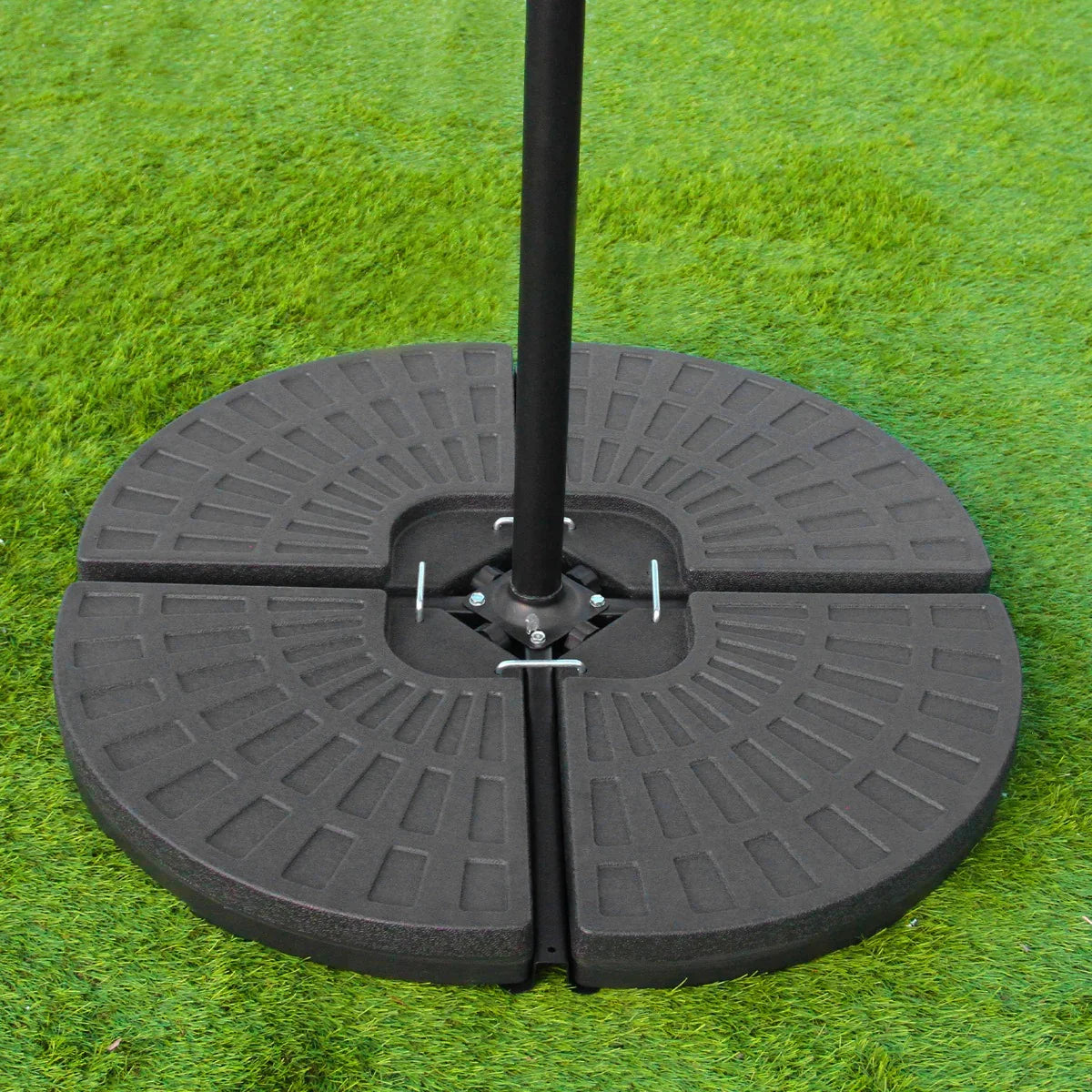 Black fan base of a green 3m LED cantilever parasol, featuring a textured surface and sturdy design, set on grass