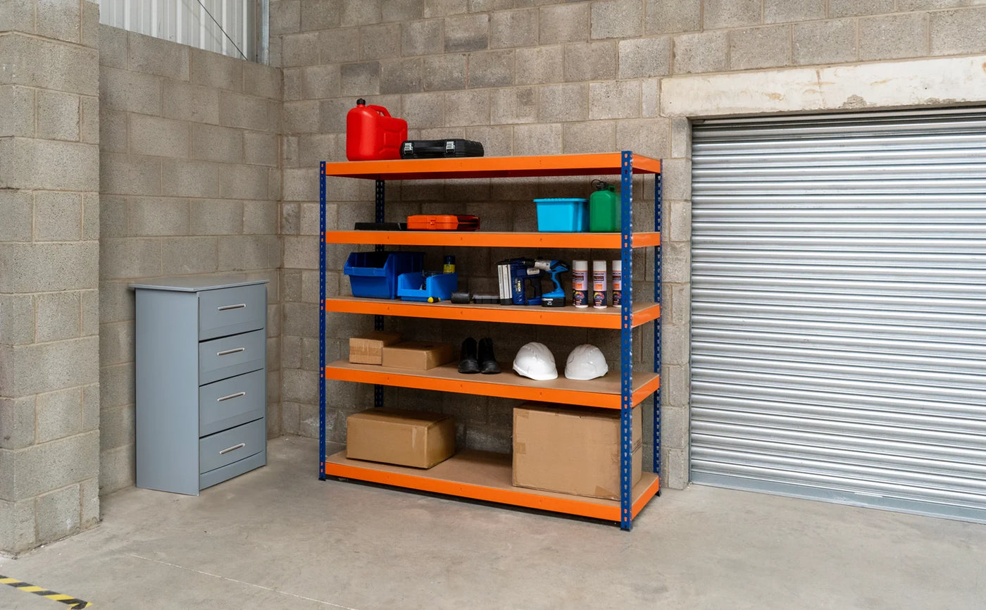 Brightly colored shelving unit with tools, safety gear, and storage boxes in a gray concrete warehouse setting