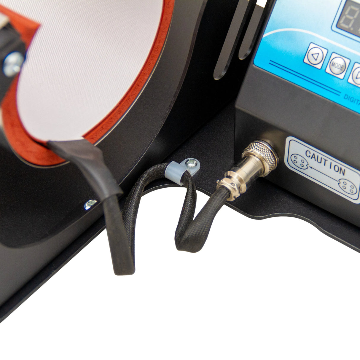 Close-up of a sublimation mug press machine showing the heating element, control panel, and safety features in black and blue design