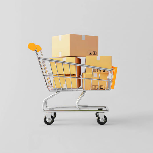 A silver shopping cart filled with stacked cardboard boxes in various sizes, featuring orange accents against a light gray background