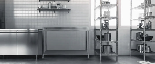 Modern kitchen with stainless steel appliances and shelves.