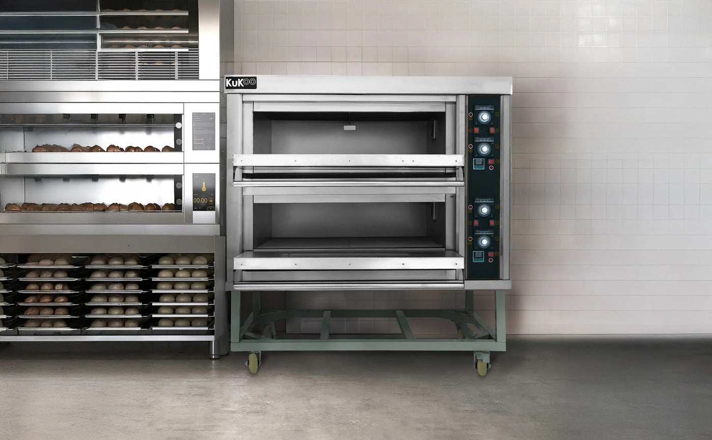 Stainless steel commercial oven with two baking chambers, featuring control panels, wheels for mobility, and a sleek design