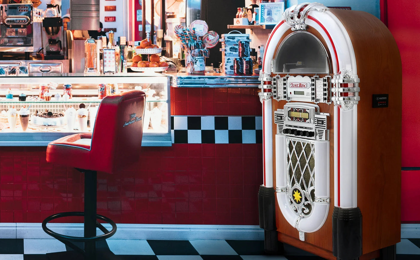 Classic retro jukebox with chrome details and vibrant red accents, set against a nostalgic diner backdrop with checkered decor