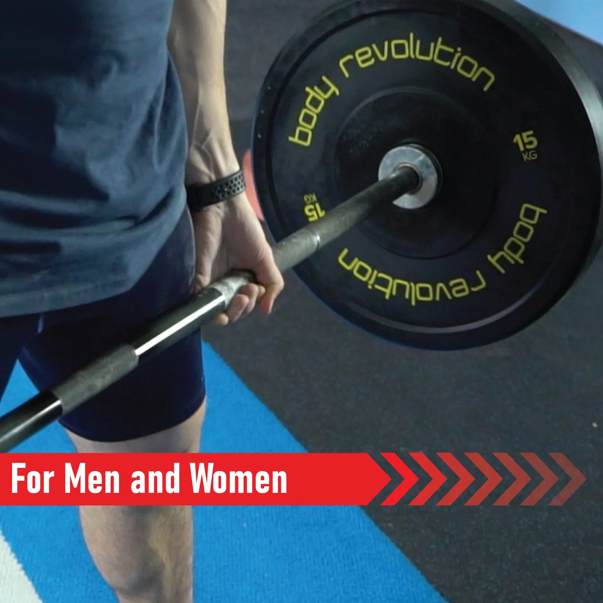 Black Olympic bumper plate with yellow lettering, held by a person, showcasing a weightlifting setup for men and women