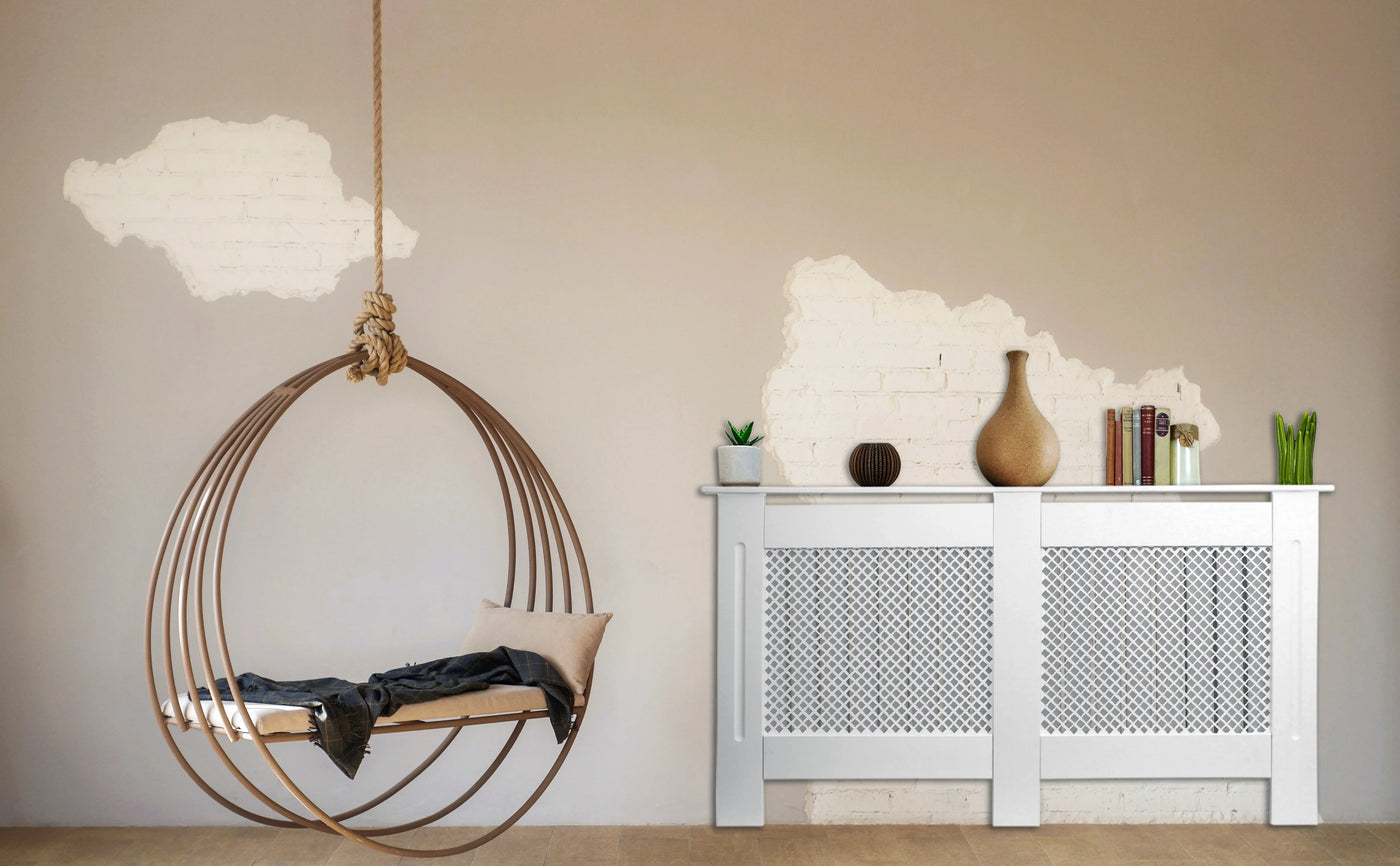 Stylish hanging chair in a modern interior, featuring a wooden frame, soft cushions, and a minimalist decor with plants and vases