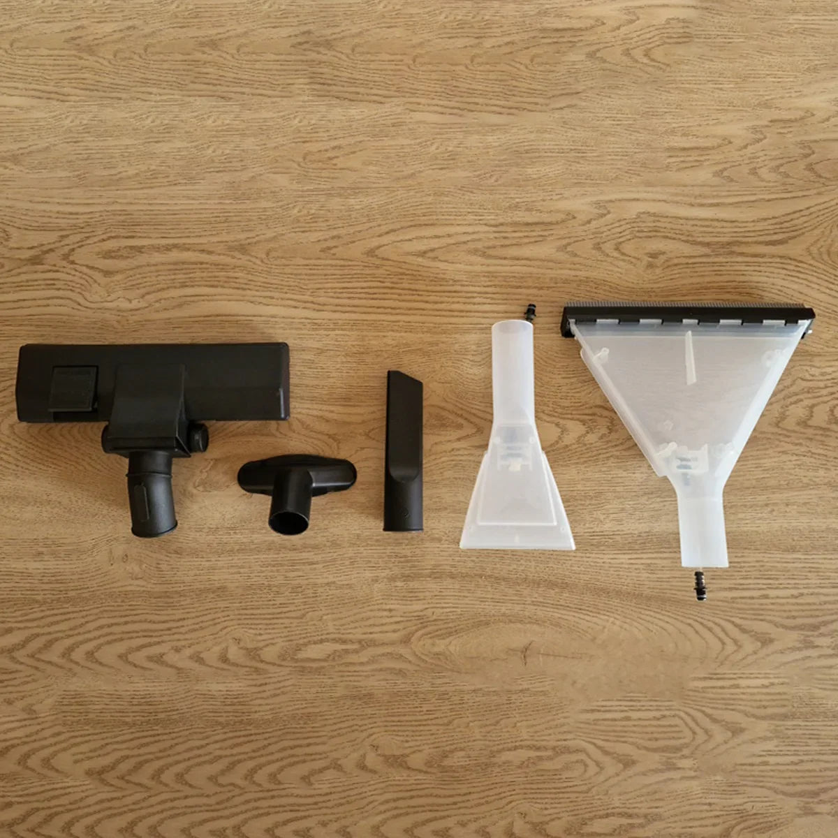 MAXBLAST Wet and Dry Vacuum Cleaner accessories including various nozzles and attachments in black and clear plastic on a wooden surface