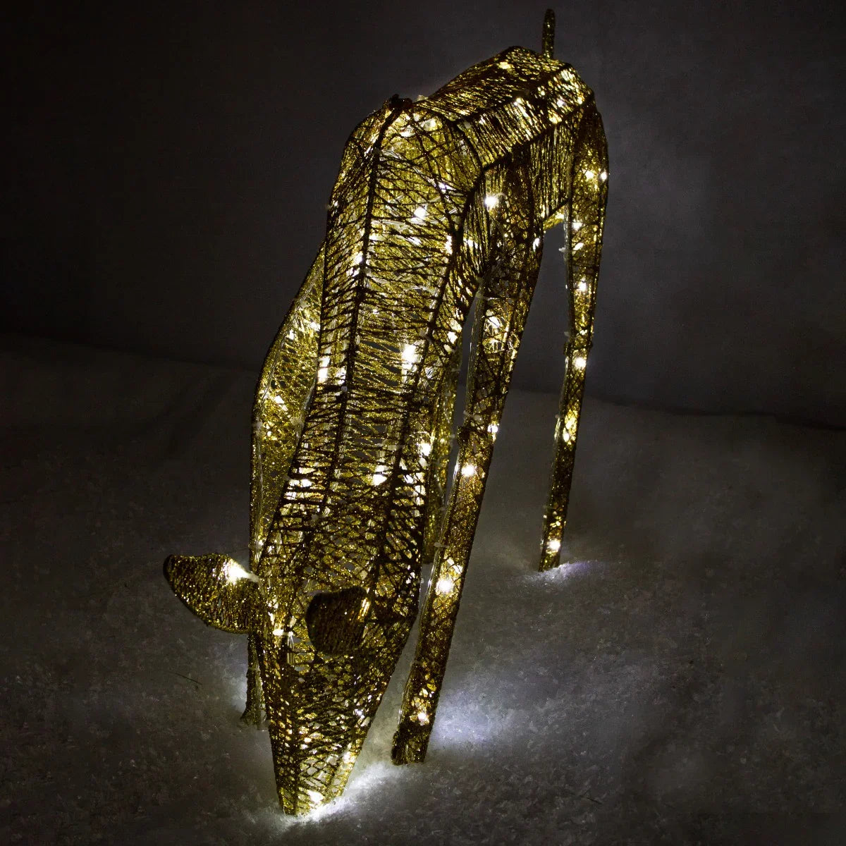 Gold grazing reindeer sculpture with 120 ice white LEDs, 61cm tall, featuring a textured finish and illuminated body, perfect for festive decor
