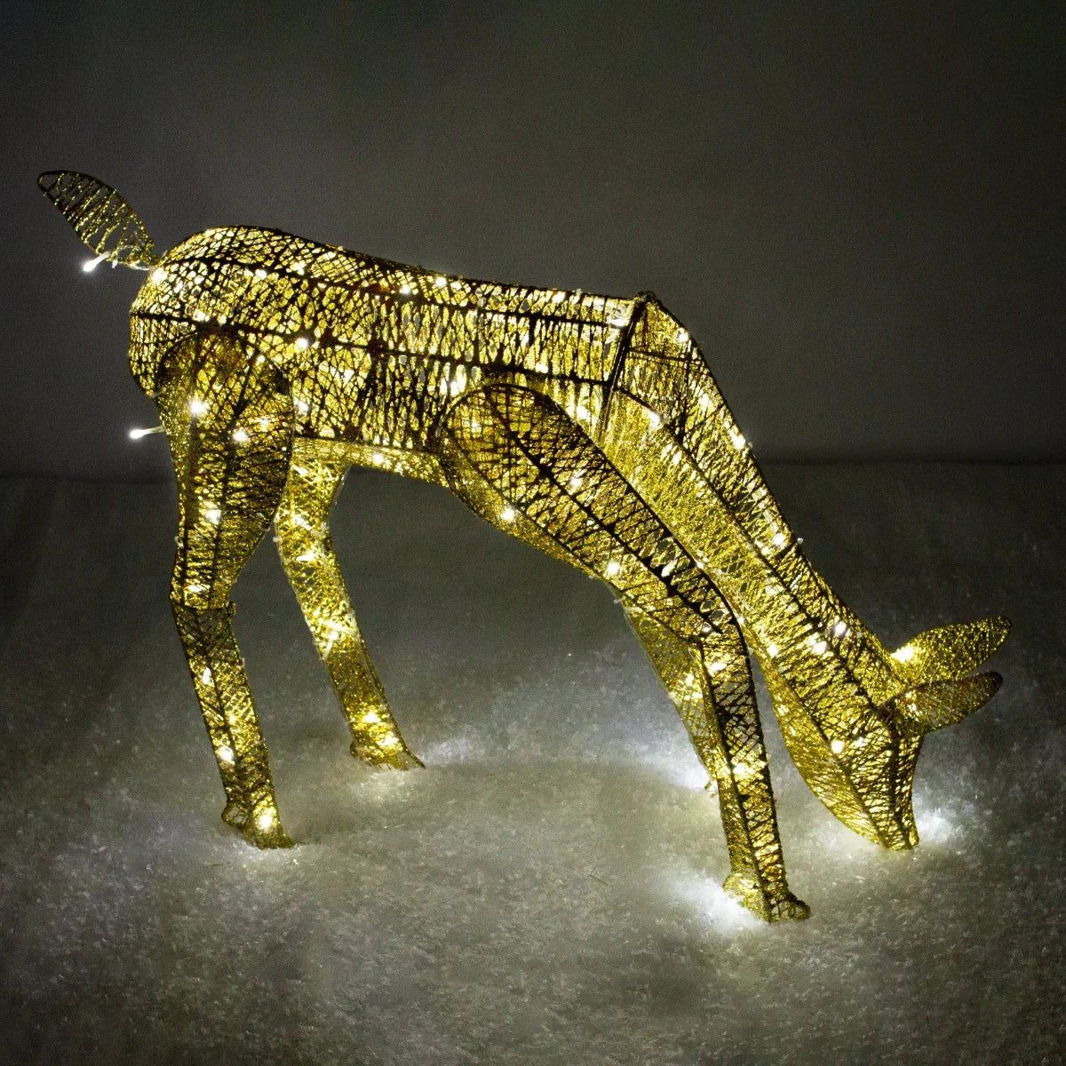 Gold stag and doe set with intricate wire design, illuminated with warm white lights, creating a festive and elegant display