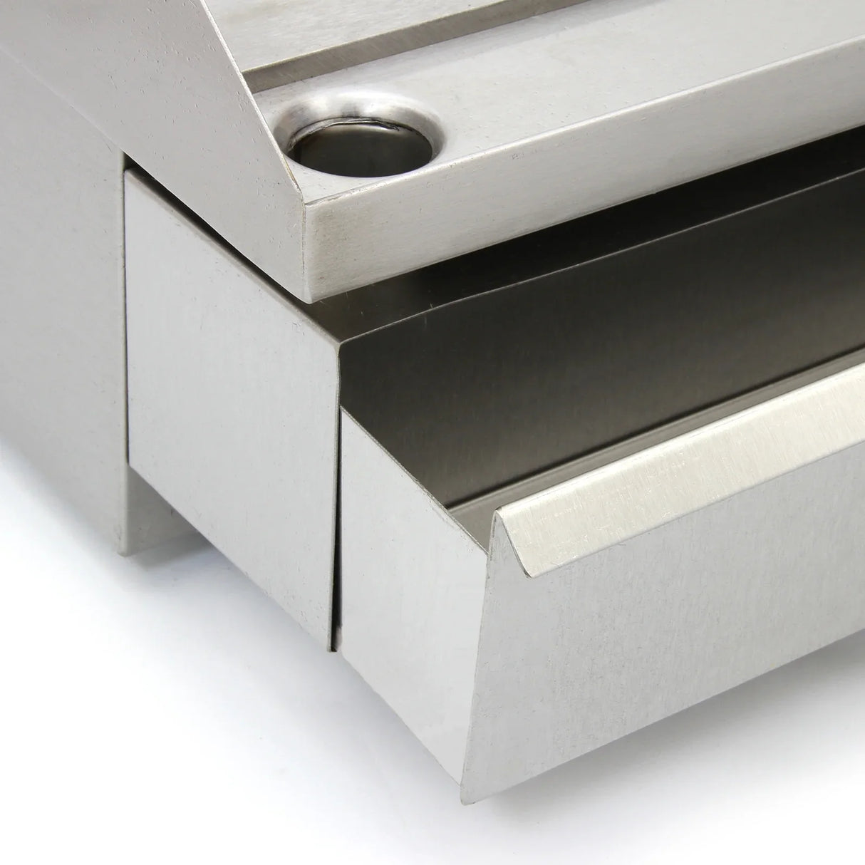 Close-up of the stainless steel edge and grease tray of the KuKoo 50cm Wide Electric Griddle, showcasing its sleek design and functionality