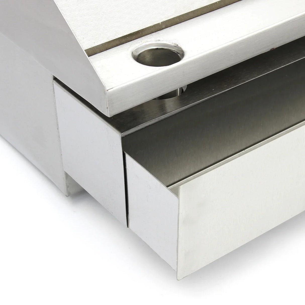 Close-up of the stainless steel edge and grease tray of the KuKoo 70cm Wide Electric Griddle, showcasing sleek design and durability