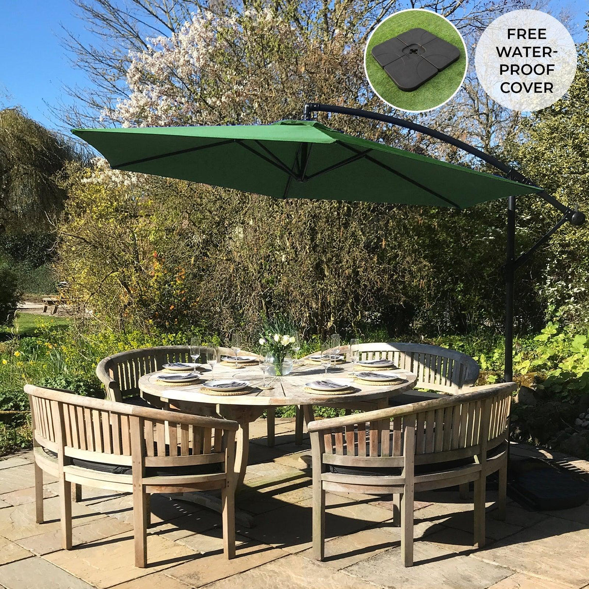 Green cantilever parasol with a square base, providing shade over a circular wooden dining table set in a garden setting