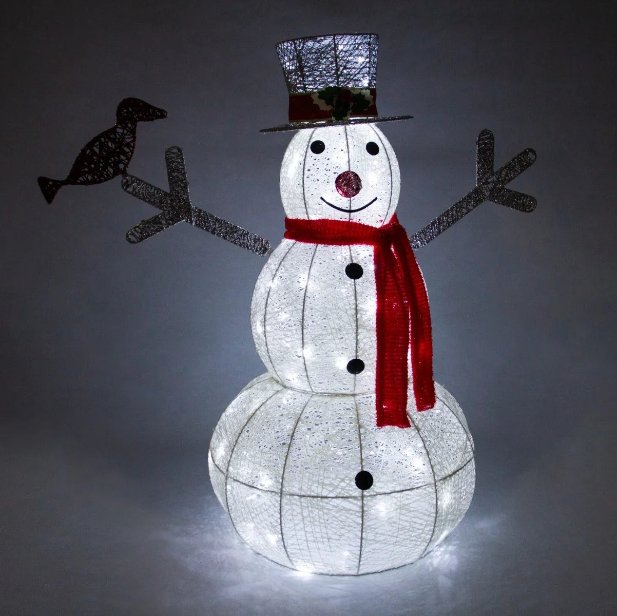 Brightly lit snowman with a top hat, red scarf, and bird on arm, made of white mesh material, perfect for festive decor