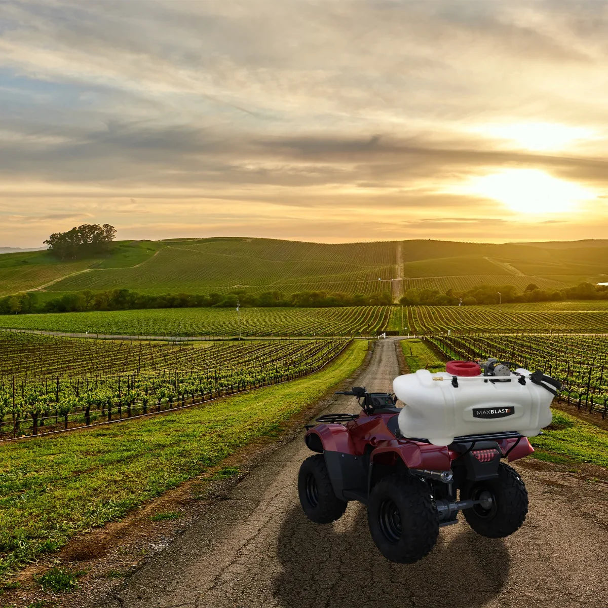 60L ATV sprayer on a quad bike, featuring a white tank, red cap, and scenic vineyard backdrop under a sunset sky