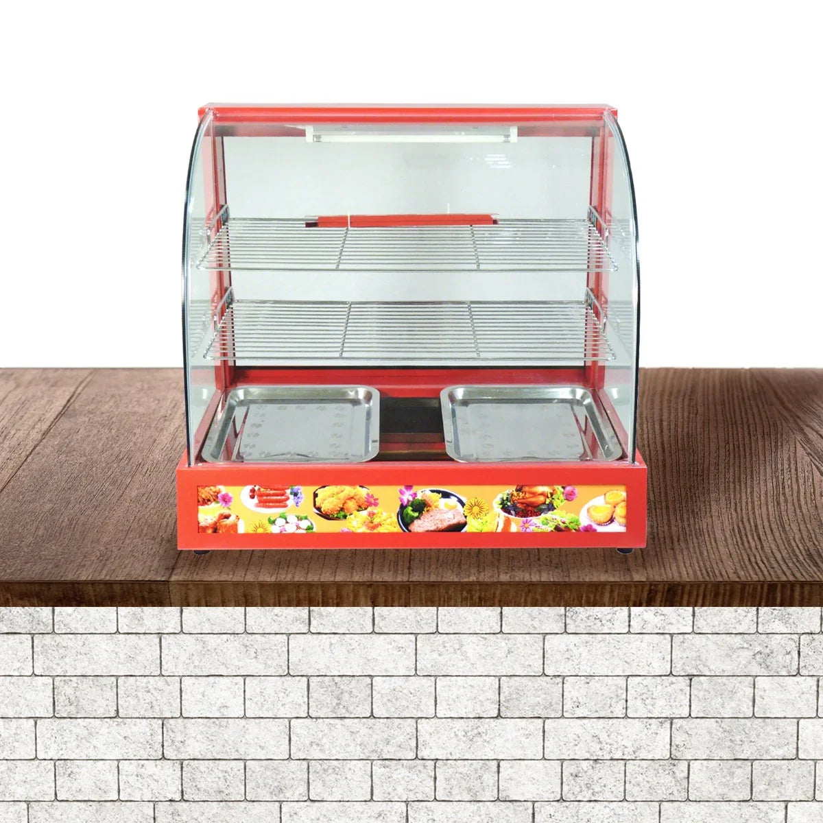 KuKoo 60cm wide glass food warmer with a red base, clear glass front, and two stainless steel trays for displaying food items